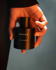 wayne fragrance bottle in hand