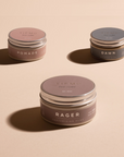 three products, Rager clay in front with Dawn Wax & Pomade cream in back