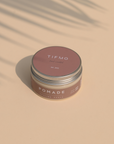 Tifmo Pomade placed under shadow of a tree