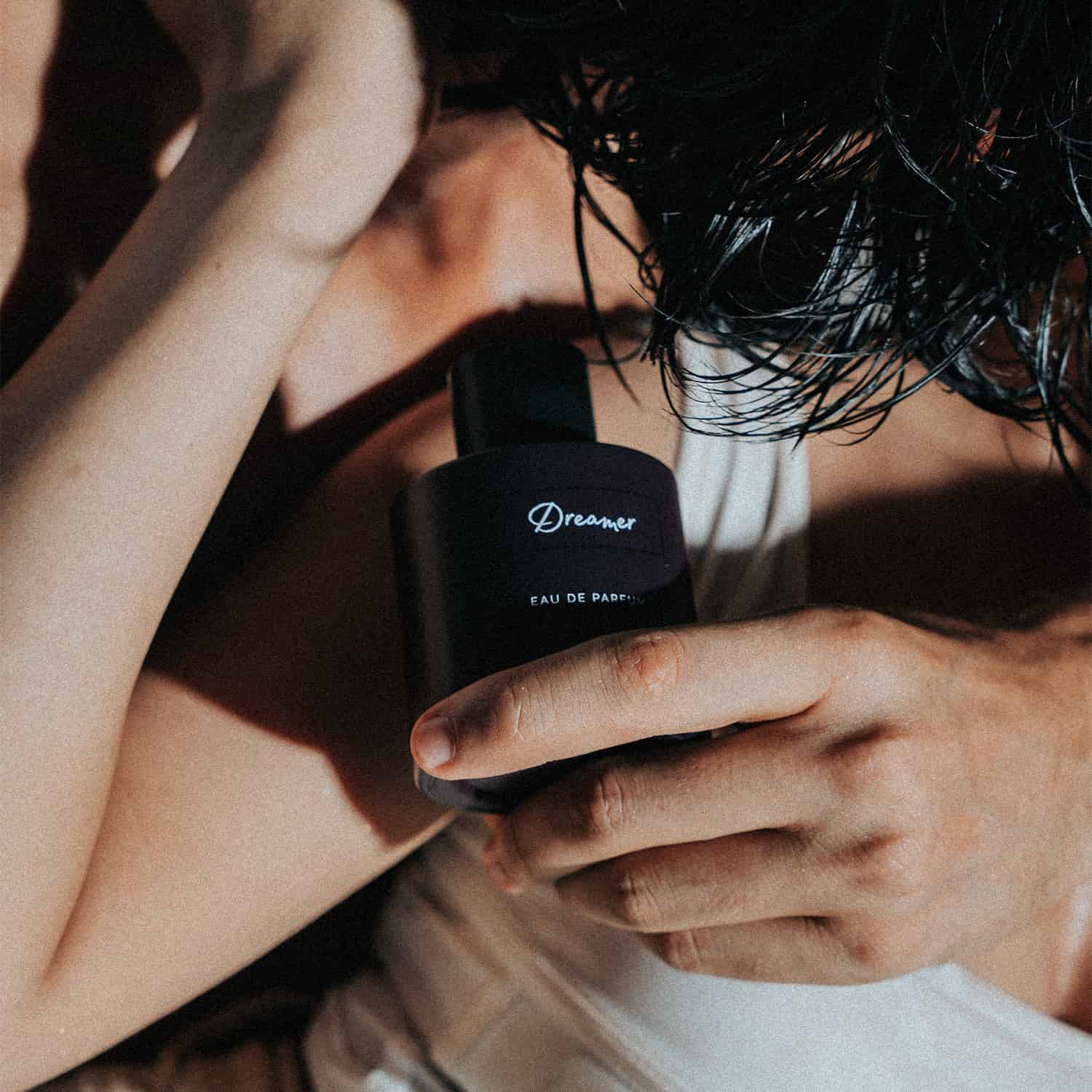 Perfume for men and women in hand