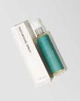 white box with sea green bottle of texture spray