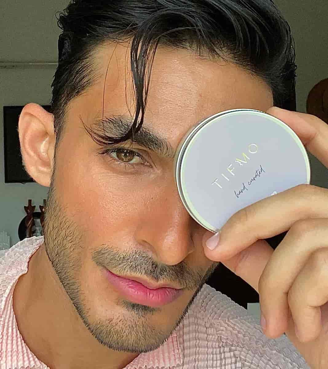 Yasser Dar holding hair wax for men hair styling