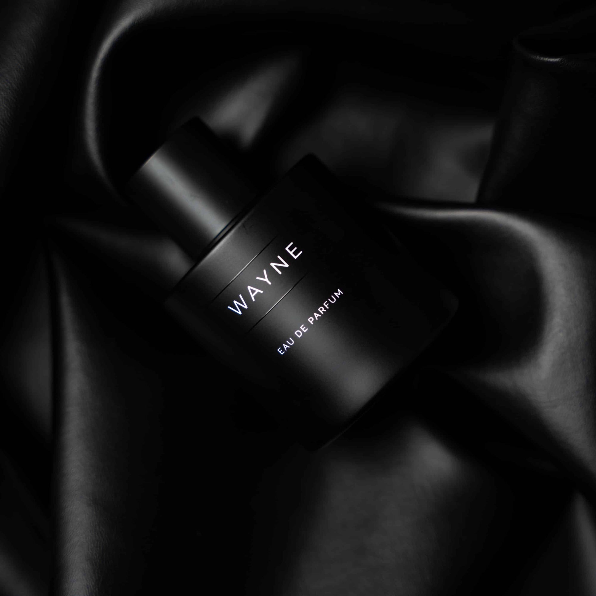 wayne winter perfume wrapped with black sheet